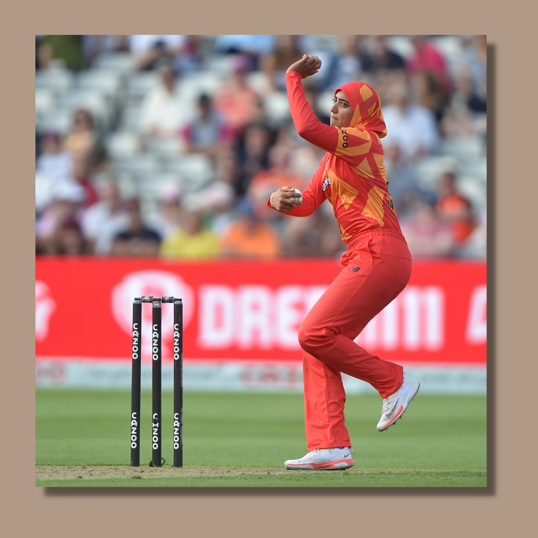 Muslim woman bowling