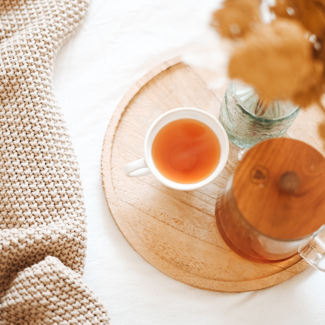 tea cup and kettle on table