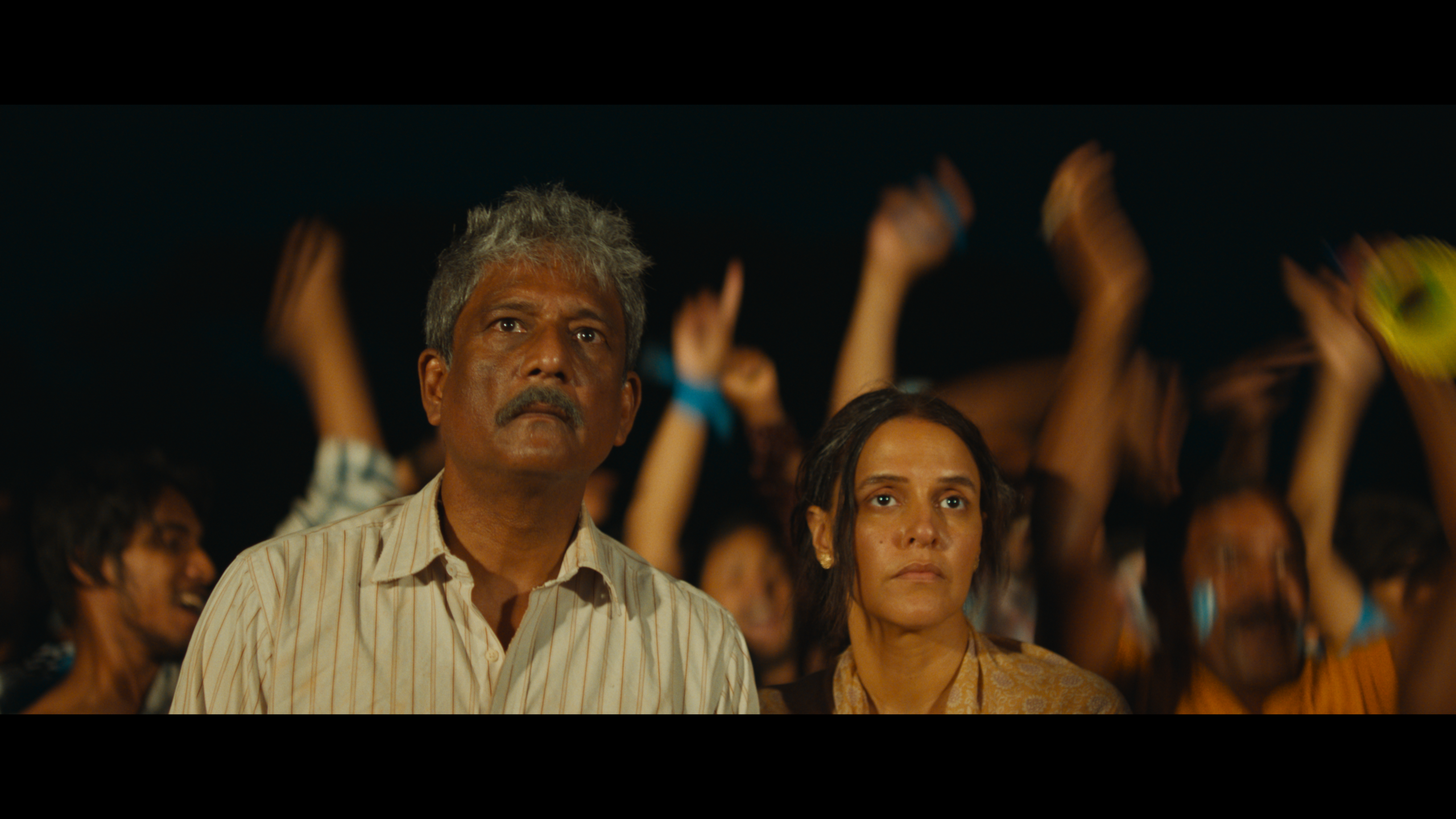 Adil Hussain and Neha Dhupia as Ashish's parents. A still from film 52 Blue