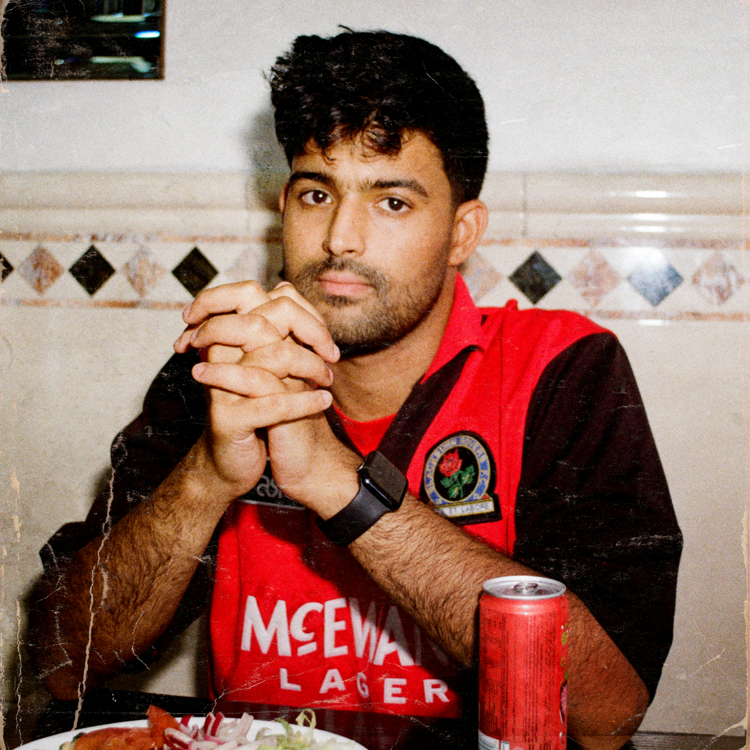 Author Sufiyaan Salam in a restaurant, image credit: Alina Akbar